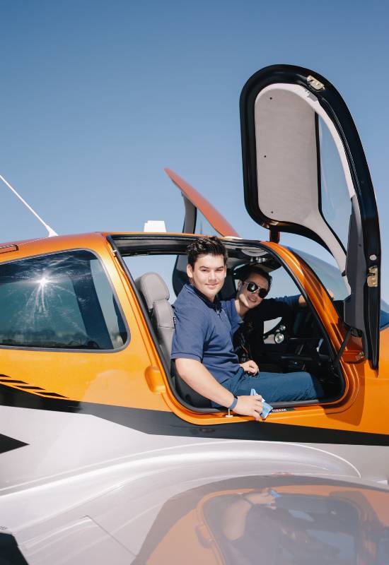 Rising Aviation students in a Cirrus airplane