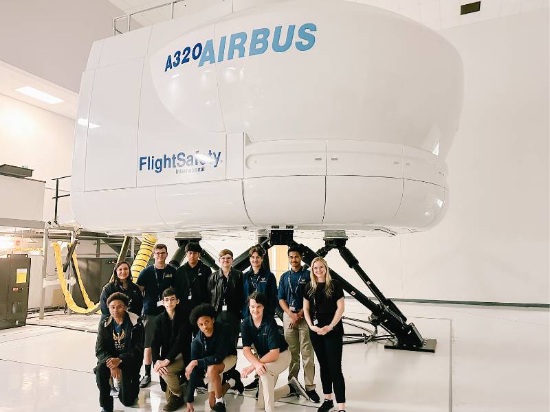 stem students in front of airbus simulator